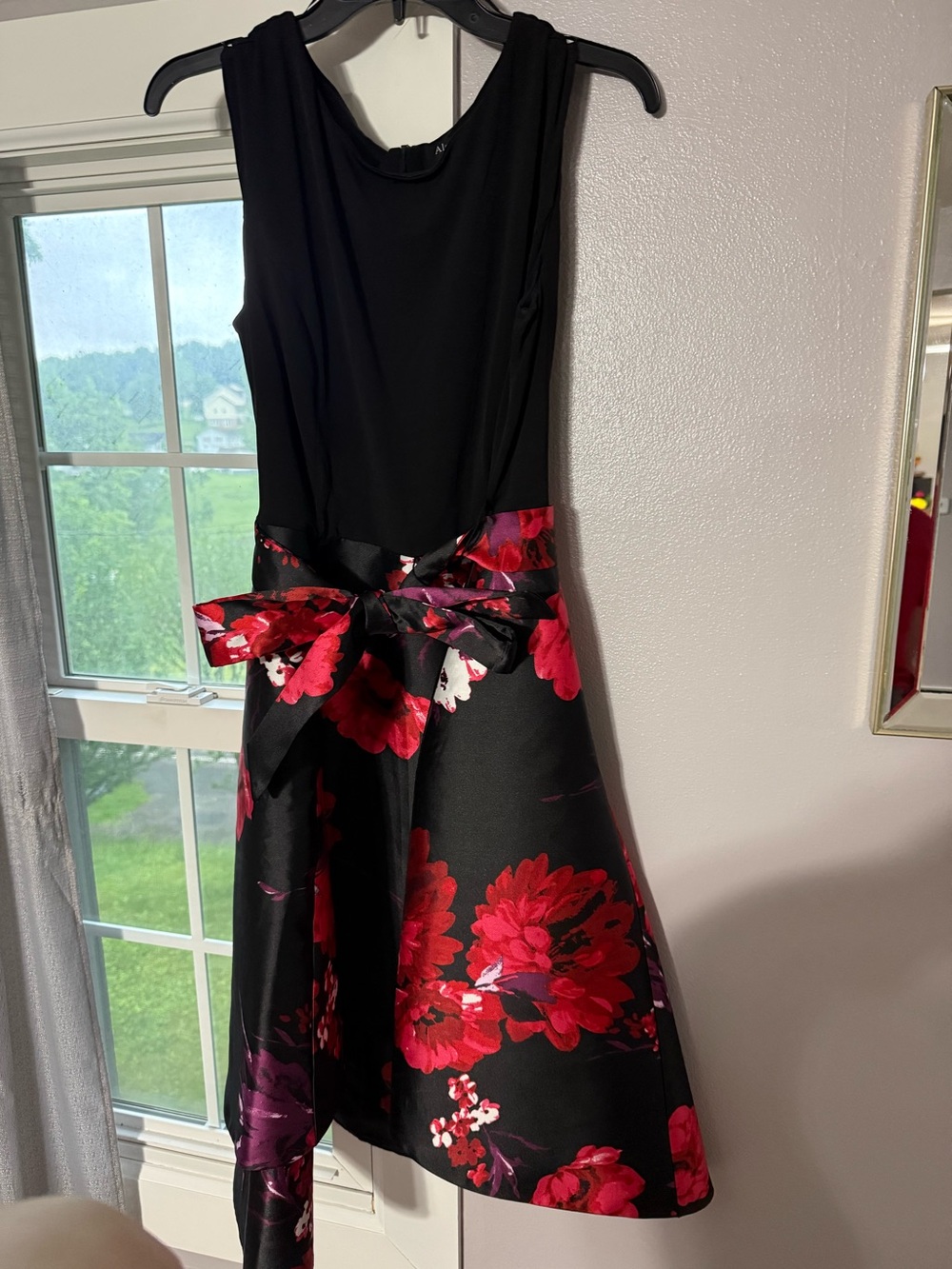 Elegant Black Fit-and-Flare Dress with Red Floral Skirt
